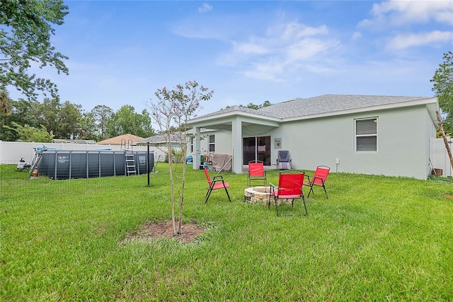 7 Pine Bush Ln, Palm Coast, FL 32164 - view of yard with an outdoor fire pit and a pool