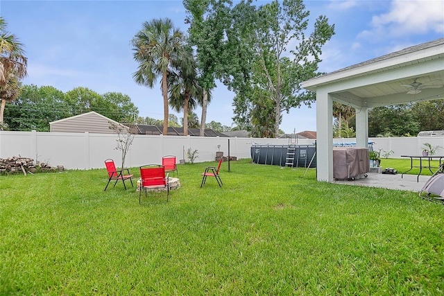 7 Pine Bush Ln, Palm Coast, FL 32164 - fenced backyard featuring ceiling fan, a patio, and a pool