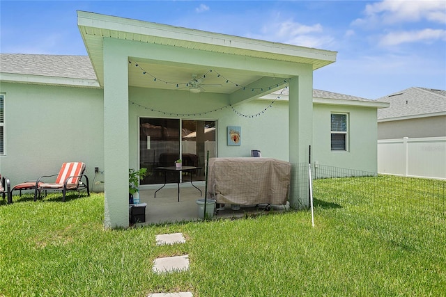 7 Pine Bush Ln, Palm Coast, FL 32164 - back of property featuring stucco siding, a patio area, a ceiling fan, and roof with shingles