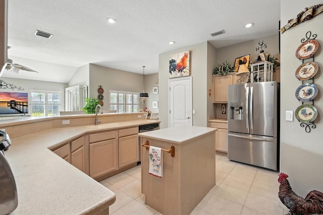 67 Lagare St, Palm Coast, FL 32137 - kitchen featuring appliances with stainless steel finishes, light countertops, plenty of natural light, light tile patterned floors, and a textured ceiling