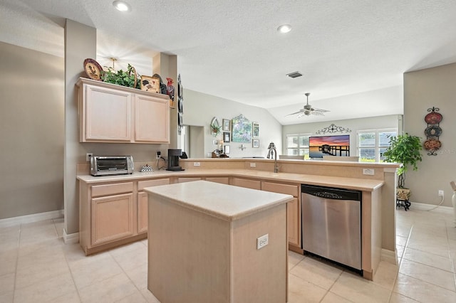 67 Lagare St, Palm Coast, FL 32137 - kitchen featuring dishwasher, a peninsula, a ceiling fan, light brown cabinetry, and light countertops