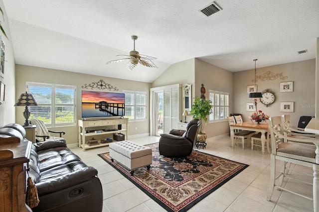 67 Lagare St, Palm Coast, FL 32137 - living room featuring light tile patterned flooring, a ceiling fan, and vaulted ceiling