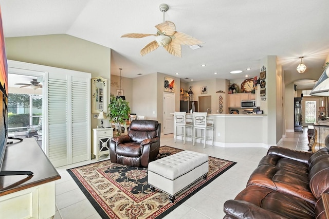 67 Lagare St, Palm Coast, FL 32137 - living room with ceiling fan, light tile patterned floors, plenty of natural light, vaulted ceiling, and arched walkways