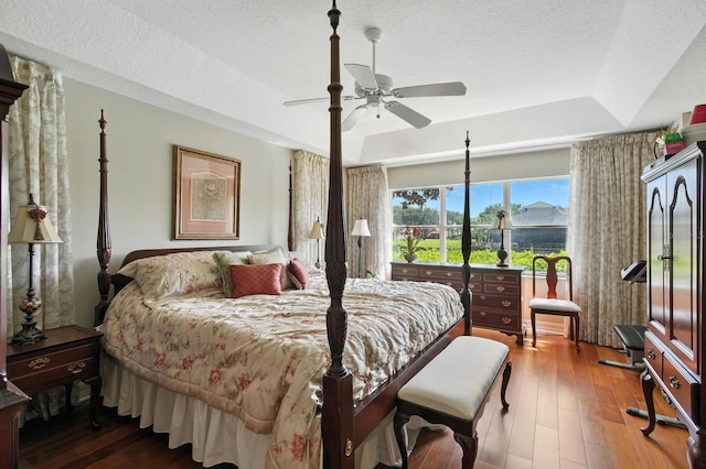 67 Lagare St, Palm Coast, FL 32137 - bedroom featuring hardwood / wood-style floors, a raised ceiling, a textured ceiling, and ceiling fan