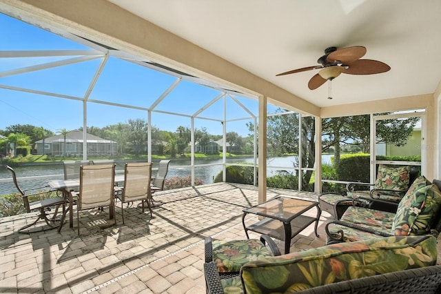 67 Lagare St, Palm Coast, FL 32137 - view of patio with a water view, outdoor lounge area, glass enclosure, a ceiling fan, and outdoor dining space