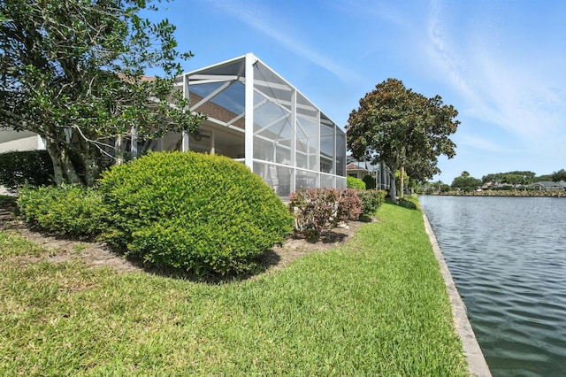 67 Lagare St, Palm Coast, FL 32137 - view of green lawn featuring a water view and glass enclosure