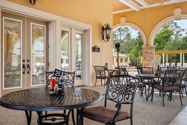 67 Lagare St, Palm Coast, FL 32137 - view of patio featuring french doors and outdoor dining space