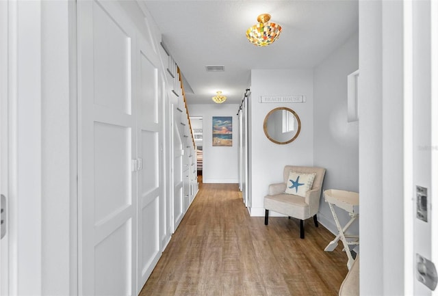 19 Bay Dr, Palm Coast, FL 32137 - hallway featuring wood finished floors and baseboards