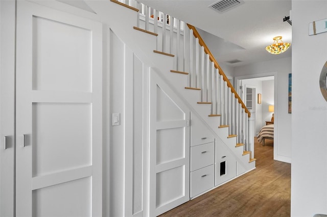 19 Bay Dr, Palm Coast, FL 32137 - staircase featuring wood finished floors and baseboards