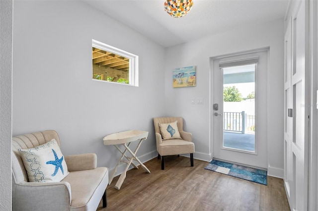 19 Bay Dr, Palm Coast, FL 32137 - living area featuring wood finished floors and baseboards