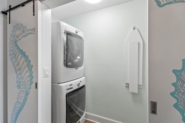 19 Bay Dr, Palm Coast, FL 32137 - laundry area with stacked washer / drying machine and a barn door