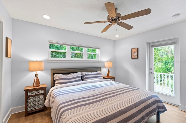 19 Bay Dr, Palm Coast, FL 32137 - bedroom featuring wood finished floors, access to exterior, recessed lighting, and ceiling fan