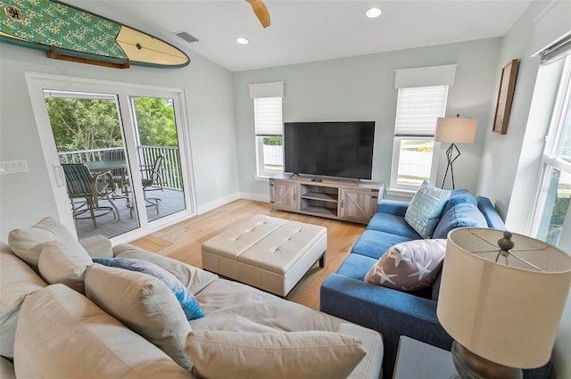 19 Bay Dr, Palm Coast, FL 32137 - living room with plenty of natural light, wood finished floors, ceiling fan, recessed lighting, and lofted ceiling
