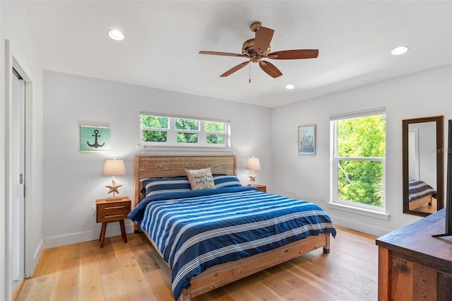 19 Bay Dr, Palm Coast, FL 32137 - bedroom with multiple windows, light wood finished floors, recessed lighting, and ceiling fan