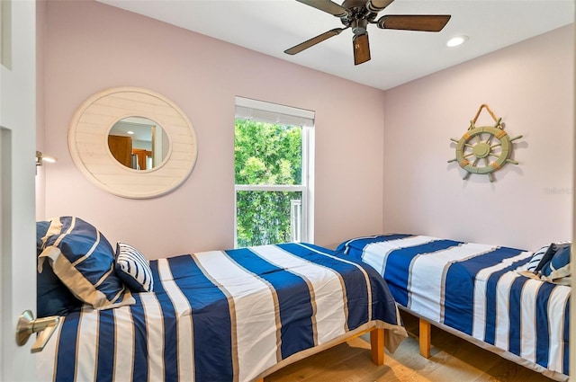 19 Bay Dr, Palm Coast, FL 32137 - bedroom with wood finished floors, ceiling fan, and recessed lighting