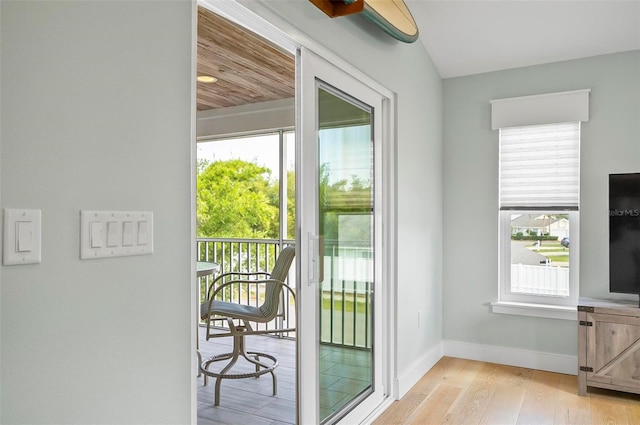 19 Bay Dr, Palm Coast, FL 32137 - doorway to outside featuring wood finished floors and healthy amount of natural light