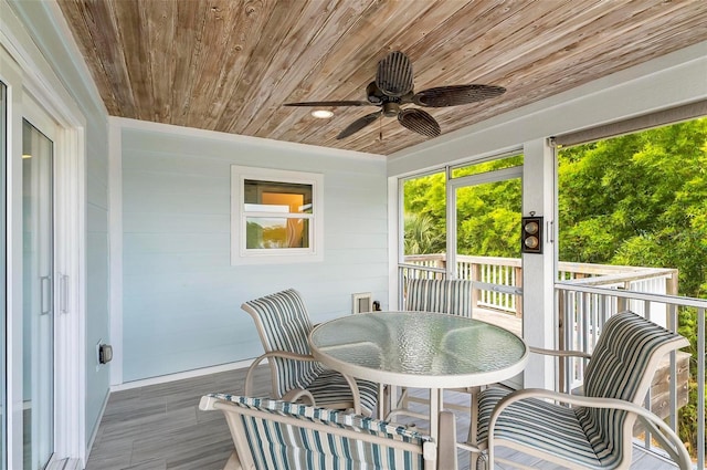 19 Bay Dr, Palm Coast, FL 32137 - sunroom with ceiling fan and outdoor dining area