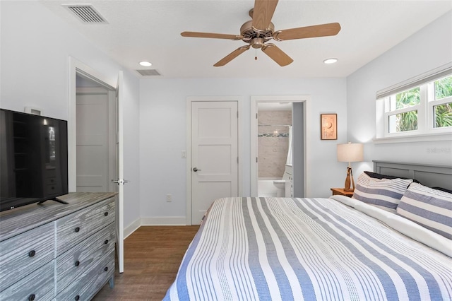 19 Bay Dr, Palm Coast, FL 32137 - bedroom with wood finished floors, ensuite bath, a ceiling fan, and recessed lighting
