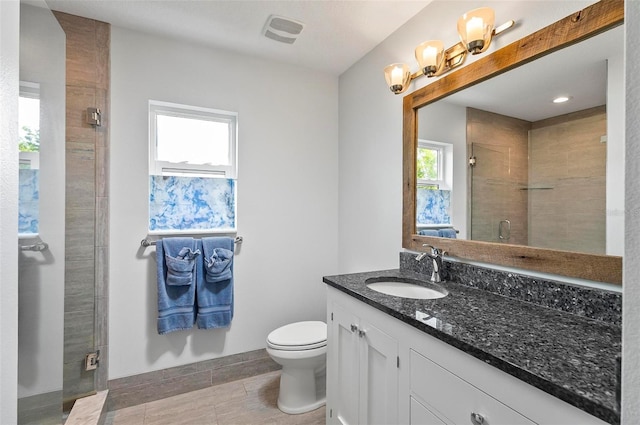 19 Bay Dr, Palm Coast, FL 32137 - bathroom featuring vanity, a stall shower, and plenty of natural light
