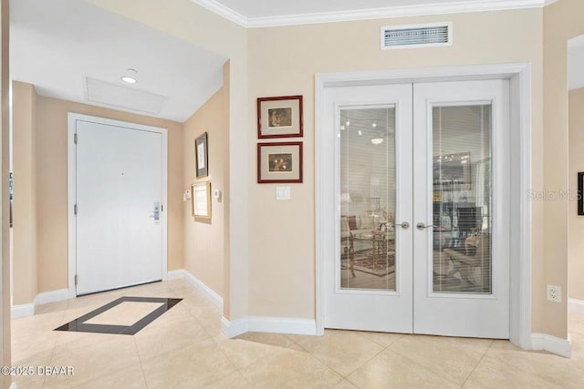 231 Riverside Dr Unit 103-1, Daytona Beach, FL 32117 - foyer entrance featuring french doors, crown molding, and light tile patterned floors