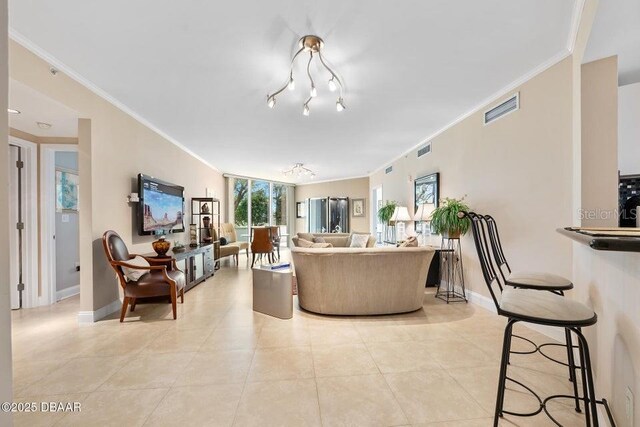 231 Riverside Dr Unit 103-1, Daytona Beach, FL 32117 - living area with crown molding and light tile patterned floors