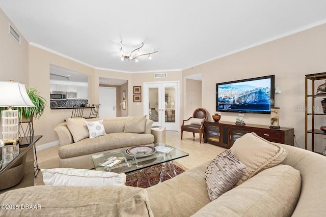 231 Riverside Dr Unit 103-1, Daytona Beach, FL 32117 - living area featuring french doors, ornamental molding, tile patterned floors, and a chandelier