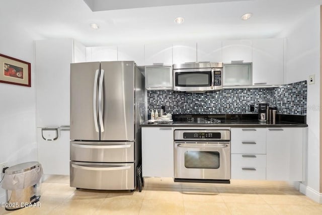 231 Riverside Dr Unit 103-1, Daytona Beach, FL 32117 - kitchen featuring stainless steel appliances, dark countertops, modern cabinets, backsplash, and recessed lighting