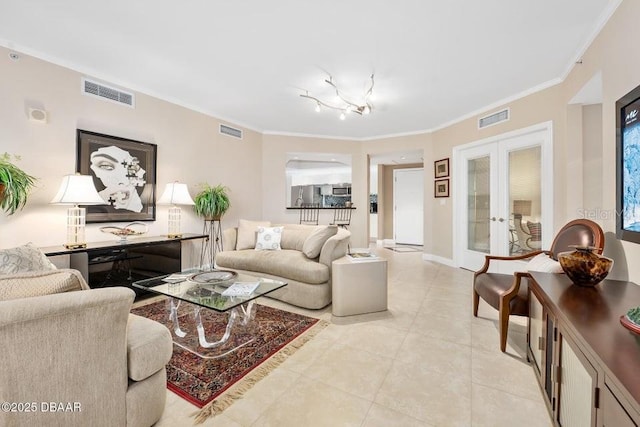 231 Riverside Dr Unit 103-1, Daytona Beach, FL 32117 - living area with french doors, ornamental molding, and light tile patterned floors