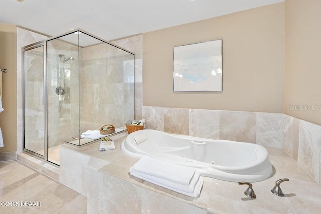 231 Riverside Dr Unit 103-1, Daytona Beach, FL 32117 - bathroom featuring a stall shower and a tub with jets