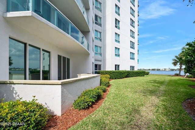 231 Riverside Dr Unit 103-1, Daytona Beach, FL 32117 - view of building exterior featuring a water view