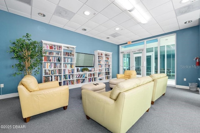 231 Riverside Dr Unit 103-1, Daytona Beach, FL 32117 - living room with carpet flooring, a paneled ceiling, and french doors