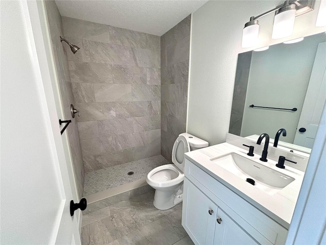 3628 S Central Ave Unit 5, Flagler Beach, FL 32136 - bathroom featuring tiled shower, vanity, and a textured ceiling