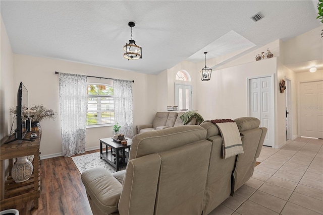 54 Pine Grove Dr, Palm Coast, FL 32164 - living area featuring lofted ceiling and light wood-style flooring
