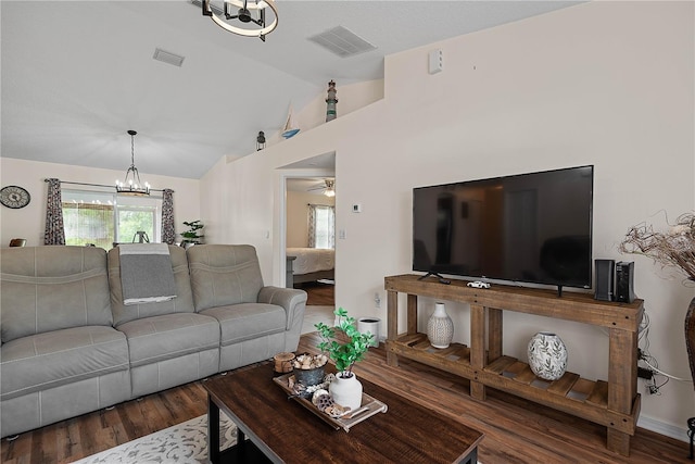 54 Pine Grove Dr, Palm Coast, FL 32164 - living area featuring a chandelier, wood finished floors, vaulted ceiling, and a ceiling fan