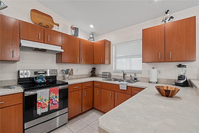 54 Pine Grove Dr, Palm Coast, FL 32164 - kitchen featuring stainless steel electric stove, under cabinet range hood, light countertops, brown cabinetry, and recessed lighting