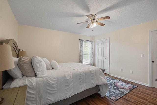 54 Pine Grove Dr, Palm Coast, FL 32164 - bedroom featuring wood finished floors, a textured ceiling, ceiling fan, and a closet