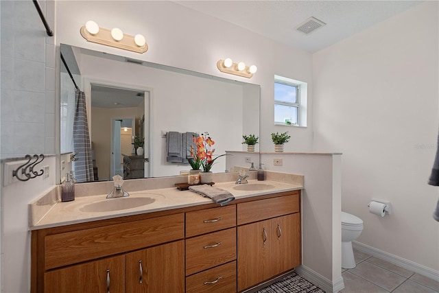 54 Pine Grove Dr, Palm Coast, FL 32164 - bathroom featuring double vanity, tile patterned floors, and tiled shower