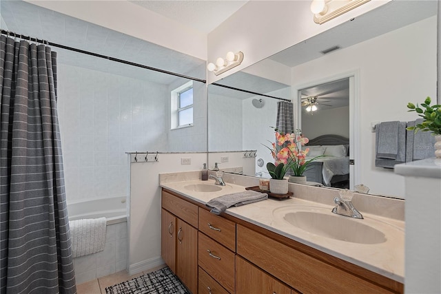 54 Pine Grove Dr, Palm Coast, FL 32164 - ensuite bathroom featuring double vanity, tiled shower / bath, tile patterned flooring, and ceiling fan