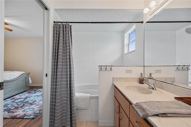 54 Pine Grove Dr, Palm Coast, FL 32164 - full bath featuring vanity, tiled shower / bath combo, and a ceiling fan