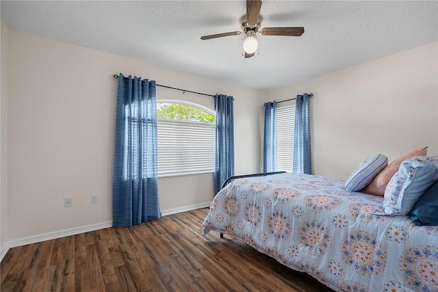 54 Pine Grove Dr, Palm Coast, FL 32164 - bedroom with wood finished floors, a ceiling fan, and a textured ceiling