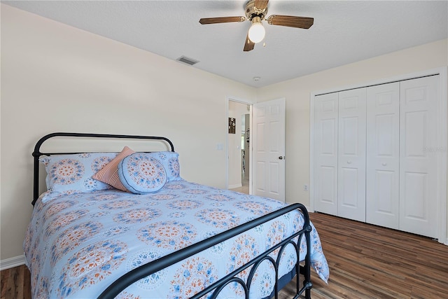 54 Pine Grove Dr, Palm Coast, FL 32164 - bedroom with wood finished floors, ceiling fan, a closet, and a textured ceiling