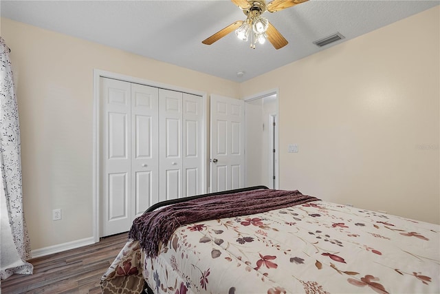 54 Pine Grove Dr, Palm Coast, FL 32164 - bedroom featuring wood finished floors, a closet, and ceiling fan