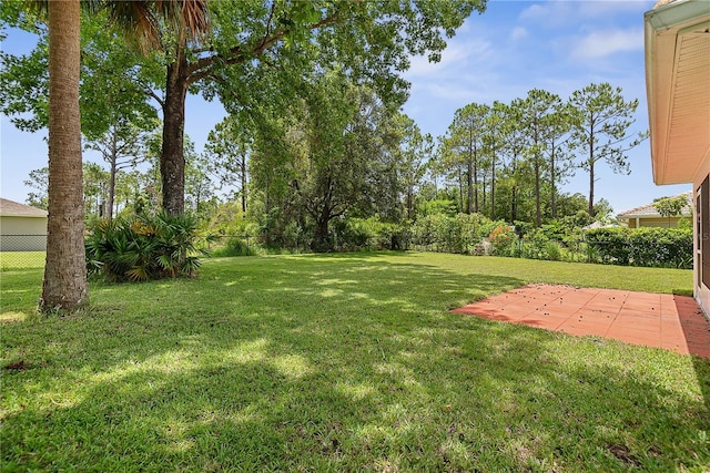 54 Pine Grove Dr, Palm Coast, FL 32164 - fenced backyard with a patio area