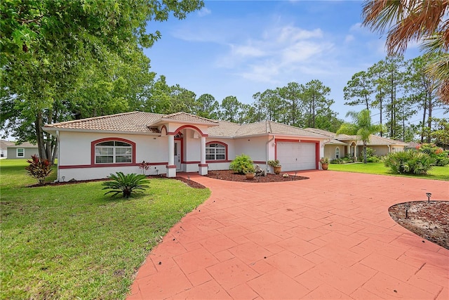 54 Pine Grove Dr, Palm Coast, FL 32164 - mediterranean / spanish-style home with stucco siding, an attached garage, and a front lawn