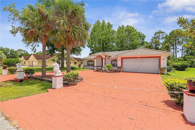 54 Pine Grove Dr, Palm Coast, FL 32164 - view of front of property with a garage, a front lawn, stucco siding, driveway, and a tile roof