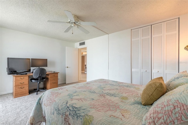3047 S Atlantic Ave Unit 706, Daytona Beach, FL 32118 - bedroom featuring light carpet, a desk, a textured ceiling, a ceiling fan, and a closet