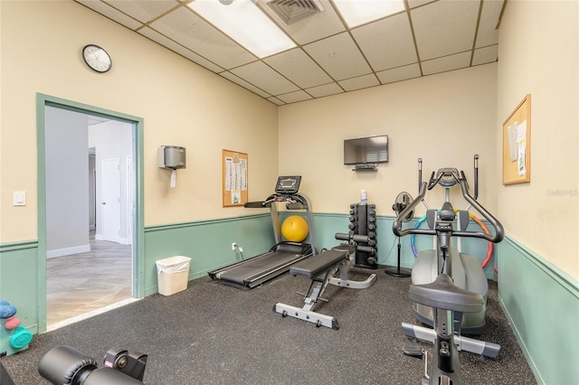 3047 S Atlantic Ave Unit 706, Daytona Beach, FL 32118 - exercise area featuring a paneled ceiling and baseboards