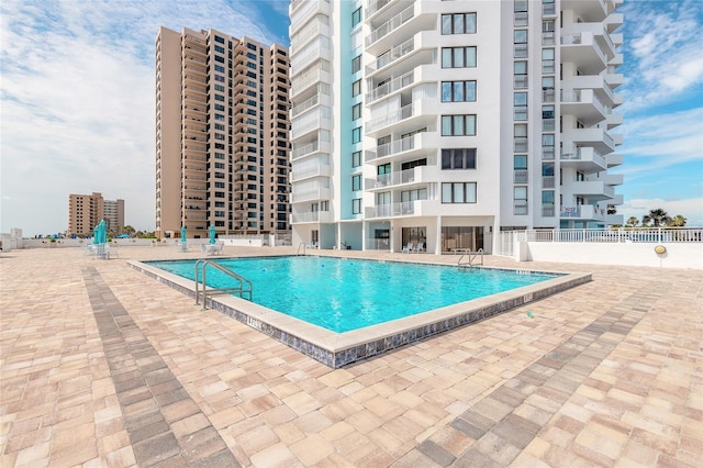 3047 S Atlantic Ave Unit 706, Daytona Beach, FL 32118 - community pool with a patio area