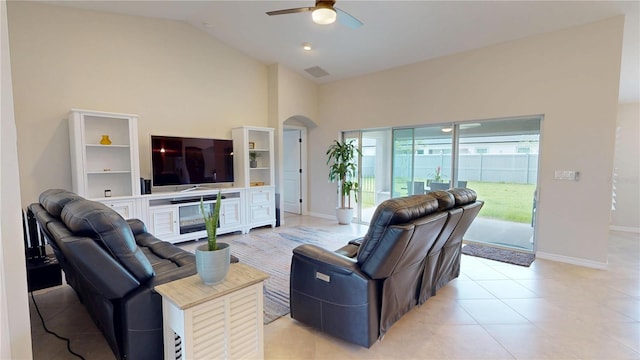 90 Randolph Dr, Palm Coast, FL 32164 - living area with ceiling fan, arched walkways, high vaulted ceiling, and light tile patterned floors