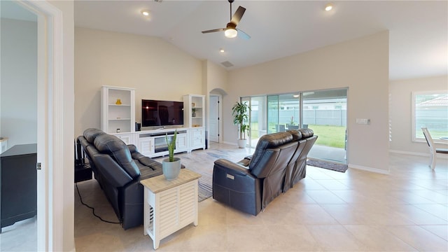 90 Randolph Dr, Palm Coast, FL 32164 - living area featuring a ceiling fan, high vaulted ceiling, light tile patterned flooring, arched walkways, and recessed lighting